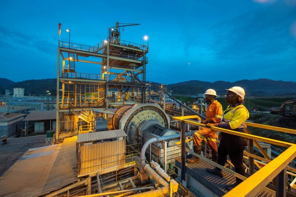 Modern Ghanaian gold mining site with financial growth chart highlighting higher mining royalties and sustained sector investment.